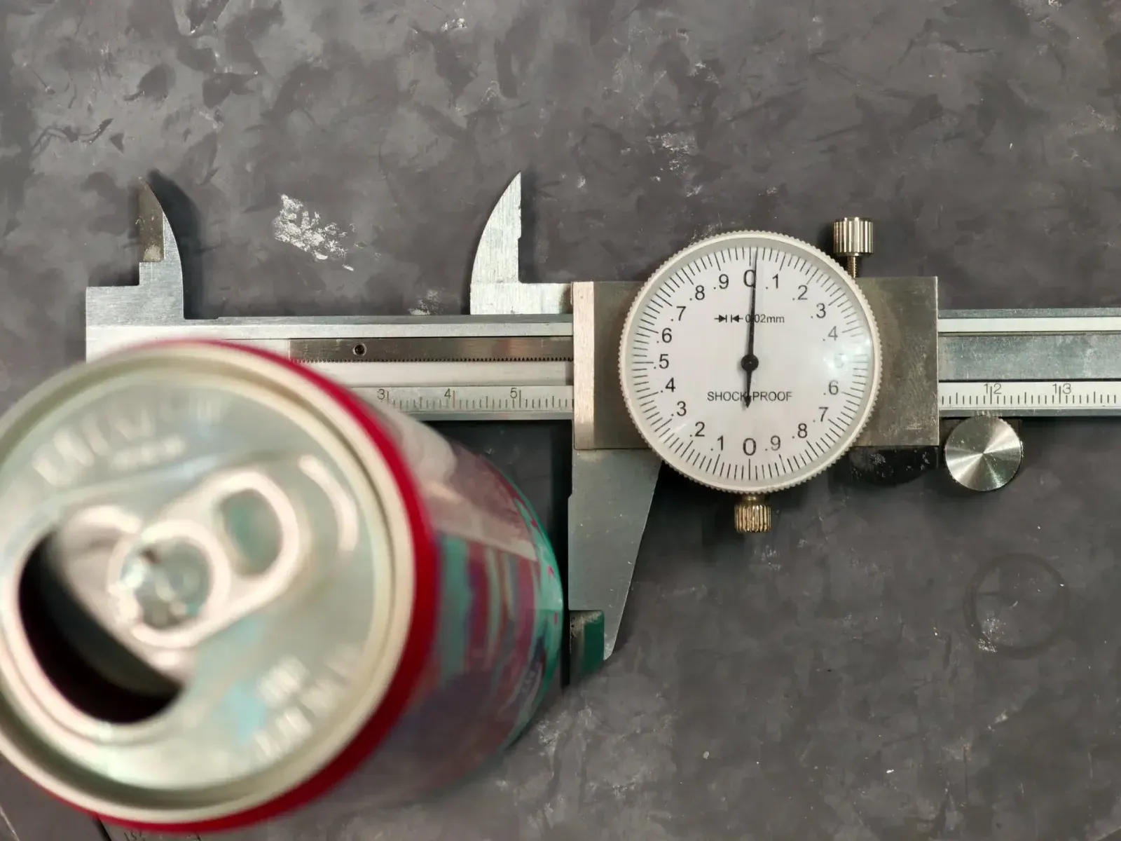 Measuring the can's diameter with calipers - about 58 mm